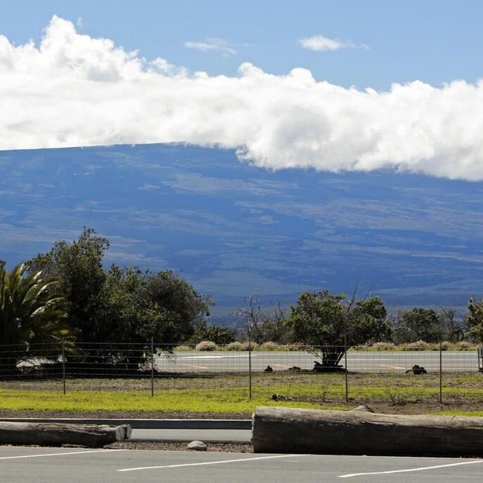 Lava from Hawaii volcano lights night sky amid warnings